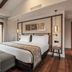 Áurea Toledo by Eurostars Hotel company in Toledo: modern guest room with king bed, bench and balcony door