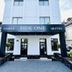 Side One Design Hotel Garni in Belgrade, exterior entrance with black awning and white facade