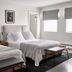 Bluebird Spa City Motor Lodge in Saratoga Springs: two neatly made beds in a bright guest room