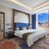 Lijiang International Hotel in Lijiang guest room with mountain view and large window