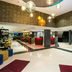 Leonardo Hotel Madrid City Center lobby in Madrid with modern bar, seating and hanging lights