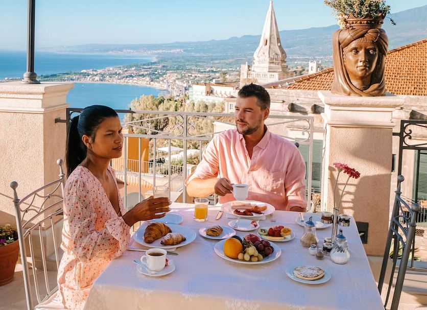 Casa Turchetti Taormina terrace breakfast with sea and town views