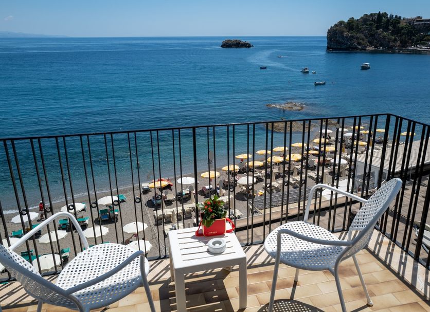 Hotel Lido Mediterranee in Taormina balcony with sea view, beach umbrellas, and lounge chairs