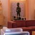 Ignacia Guest House Mexico City lounge with maroon sofa, sculptural decor and artwork