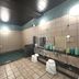 Hotel Route-Inn Oita Ekimae indoor public bath with tiled pool and shower area in Ōita