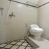RedDoorz @ Seturan Raya 2 in Depok bathroom with toilet, shower, sink and tiled floor