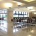 Toyoko Inn Narita Airport Honkan dining area in Narita with rows of tables and chairs near large windows