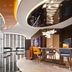 Hampton By Hilton Beijing Wangjing lobby with curved ceiling, seating area and bar in Beijing