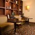 Courtyard by Marriott Los Angeles Sherman Oaks lounge with seating, desks and wall shelving