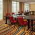 Fairfield Inn & Suites by Marriott Harrisburg International Airport meeting room in Middletown with U-shaped tables and red chairs
