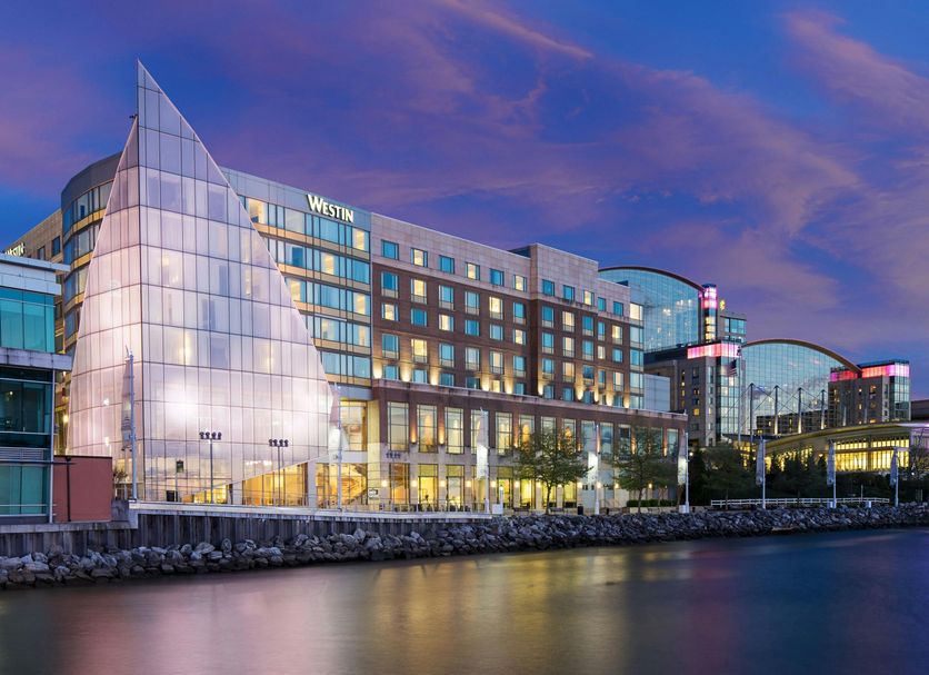 The Westin Washington National Harbor waterfront hotel exterior at dusk in National Harbor