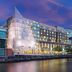 The Westin Washington National Harbor waterfront hotel exterior at dusk in National Harbor