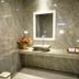 Villa Cha Cha Chaolao Beach Resort bathroom with stone sink vanity and mirror in Chanthaburi