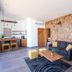 Contemplacion Resort & Spa in Ensenada with living area, sofa, hammock chair and stone accent wall