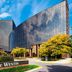 The Westin Southfield Detroit exterior in Southfield, with curved glass façade and landscaped entrance