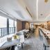 Home Inn Plus Foshan Shunde Qinghui Garden Rt-Mart restaurant with floor-to-ceiling windows and modern seating in Foshan