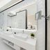Hotel Vision Budapest by Continental Group bathroom with soaking tub, double vanity and large mirror in Budapest