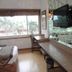 Hotel Airport Centre Point Nagpur room with desk, mirror, TV, and large window view