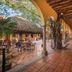 Courtyard arcade at Hotel Posada del Hidalgo by Balderrama Hotel Collection, El Fuerte, with terracotta floors