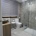 Hotel Vivar in Griñón bathroom with glass shower, toilet, sink and tiled walls