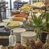 Castelmar Hotel Florianopolis breakfast buffet with pastries, fruit, bread and dining tables