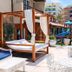 Pousada da Prainha terrace with cabana loungers and pool slide in Arraial do Cabo