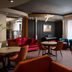 Mercure Chisinau Center Jazz Hotel lounge in Chisinau with velvet sofas, round tables and a piano