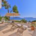 Gardenia Hotel in Kaş terrace with lounge chairs, umbrella, and sea view over the coast