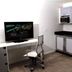 Lotus Boutique Inn & Suites Ormond Beach room with desk, TV, kitchenette, and mini fridge