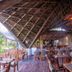 Le Cameleon Boutique Hotel in Puerto Viejo de Talamanca, open-air bamboo restaurant with wooden tables