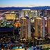 The Signature At Mgm Grand in Las Vegas with illuminated towers and Strip skyline at dusk