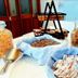 Dolphin Hotel Skopelos breakfast buffet with pastries, cereal, and jam packets on a table