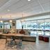 Home2 Suites by Hilton Tampa - USF/Near Busch Gardens lobby seating area with large windows and bar stools