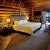 Tigh-Na-Mara Seaside Spa Resort in Parksville suite with fireplace, sofa and ocean-view balcony