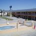 Texas Inn And Suites At La Joya exterior with outdoor pool and two-story motel-style rooms in La Joya