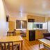 Motel 6 Bernalillo room with kitchenette, sofa, table, and bed