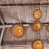 Les Villas Ottalia Yoga & Diving, Gili Meno: woven rattan pendant lights on a wooden ceiling