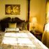 Gatekeeper's Retreat Niagara-on-the-Lake bedroom with four-poster bed and bedside lamps