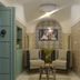 Dar Hammamet Guest House & Hammam in Hammamet: tiled spa lounge with two armchairs and a small table