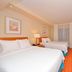 Fairfield Inn and Suites by Marriott Williamsport guest room with two beds and TV