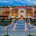 Centara Mirage Resort Mui Ne in Phan Thiet, illuminated beachfront resort facade with terracotta roofs and terraces