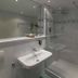 Churfuerstliche Waldschaenke in Moritzburg bathroom with glass shower, wall-mounted sink and mirror
