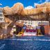 Planet Hollywood Cancun, An Autograph Collection Resort in Cancún: rock waterfall over a resort pool slide