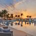 Waldorf Astoria Ras Al Khaimah poolside loungers and palm trees at sunset, Ras Al Khaimah
