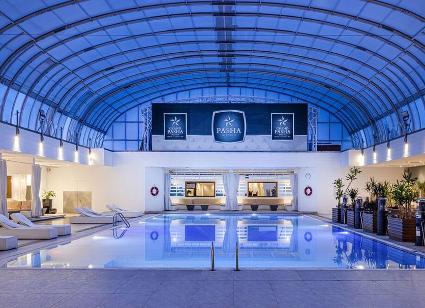 Grand Pasha Lefkosa Hotel And Casino And Spa in Nicosia, indoor pool beneath a blue arched glass سقroof