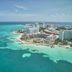 Fiesta Americana Cancun Villas in Cancún with turquoise ocean views and beachfront high-rise buildings