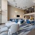 Comfort Inn Aikens Center in Martinsburg lobby seating area with high ceilings and modern tables