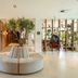 Leonardo Hotel San Sebastián lobby with round sofa, bicycles, and a tree centerpiece in San Sebastián