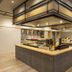 Dormy Inn Kawasaki Natural Hot Spring breakfast buffet area with island counters and mezzanine railing