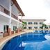 Nadivana Serviced Apartment in Krabi with a large outdoor pool and balcony-lined resort buildings
